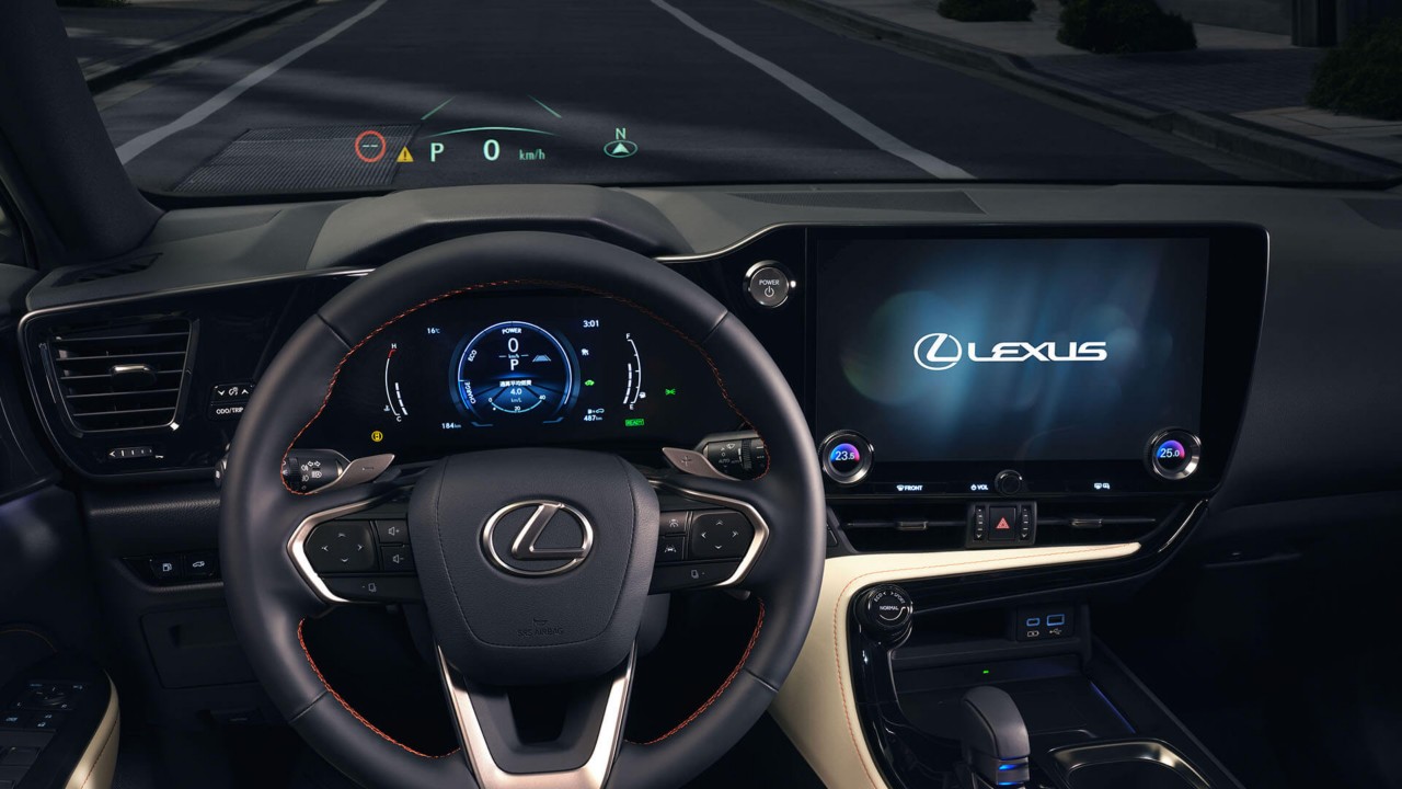 Lexus NX 450+ driving in a city location 
