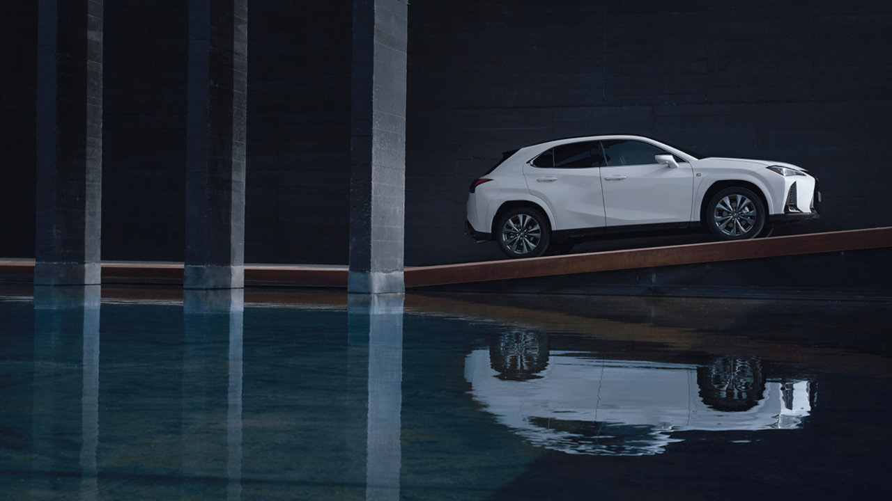 Lexus UX driving up a ramp