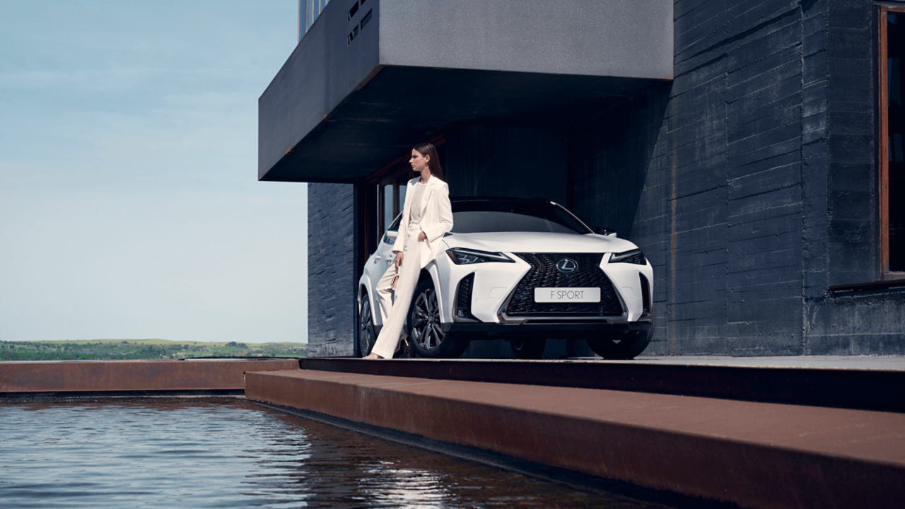  A person leaning on the Lexus UX