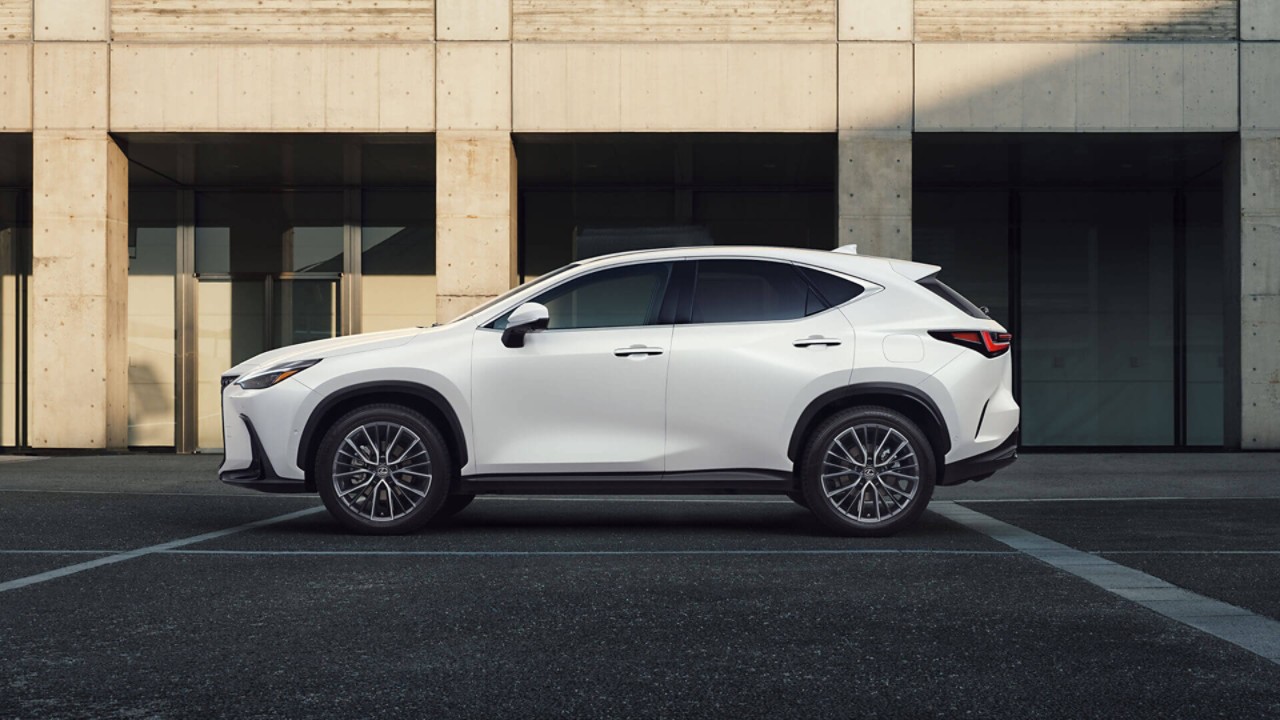 Lexus NX 450+ driving in a city location 