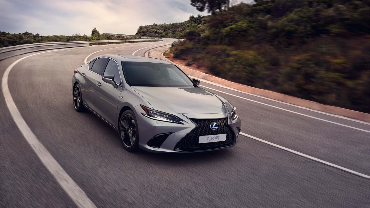 Lexus ES 300h driving in a rural area 